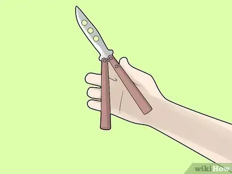 Imagen titulada Perform a Trebuchet with a Butterfly Knife Step 2