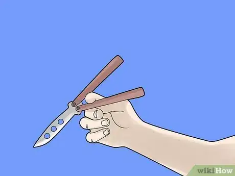 Imagen titulada Perform a Trebuchet with a Butterfly Knife Step 3
