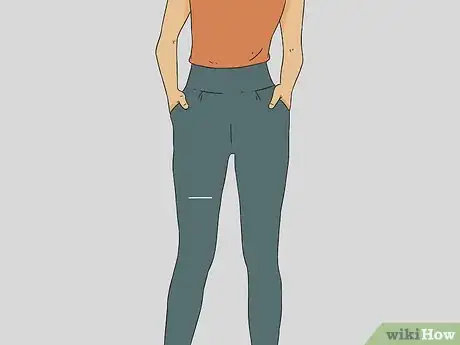 Imagen titulada Cut Knee Holes in Jeans Step 1