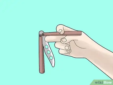 Imagen titulada Perform a Trebuchet with a Butterfly Knife Step 4