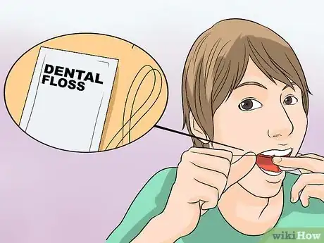 Imagen titulada Remove Popcorn from Your Teeth Step 1