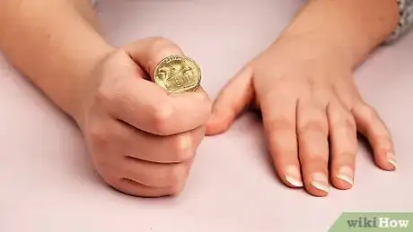 Imagen titulada Do a Simple Coin Magic Trick Step 15