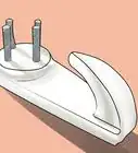 encontrar vigas de madera en una pared para colgar cuadros