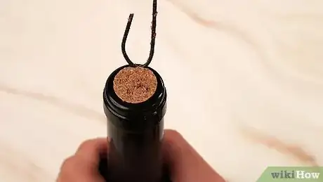 Imagen titulada Open a Wine Bottle Without a Corkscrew Step 20