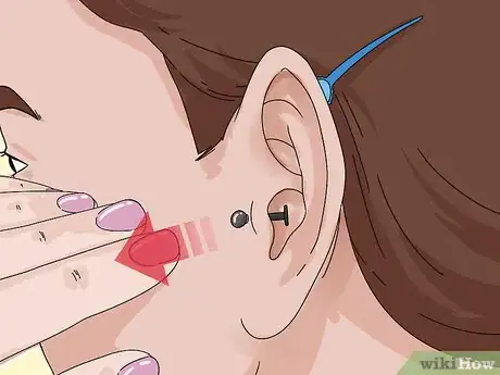 Imagen titulada Take a Tragus Piercing Out Step 3