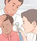 quitar un objeto de la oreja de un niño