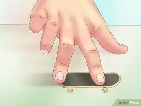 Imagen titulada Kickflip on a Tech Deck Step 12