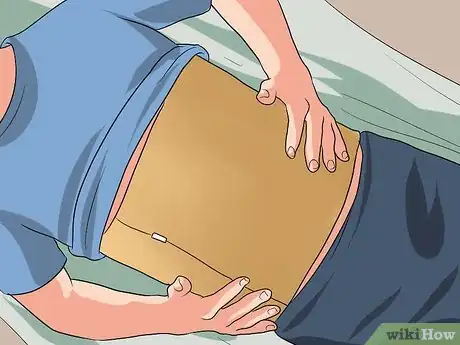 Imagen titulada Push a Hernia Back in Step 4