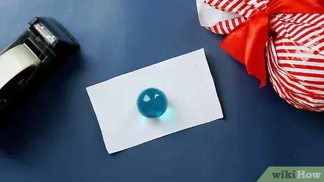 Imagen titulada Wrap a Round Gift Step 6
