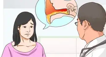 usar un otoscopio