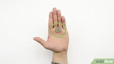 Imagen titulada Make a Quarter Disappear Step 12