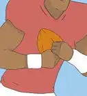 atrapar un balón de fútbol americano
