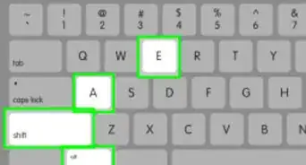 taper un symbole sur un ordinateur portable