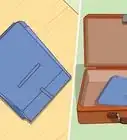 mettre un costume dans une valise