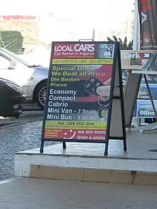 A-board set up next to a store