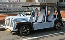 Image of a light blue 2019 Moke America eMoke designed by Michael Young