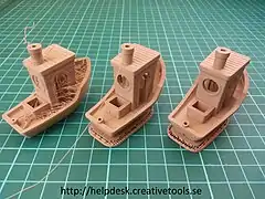 3DBenchys printed on a fused deposition modeling 3D printer showing different faults caused by miscalibration