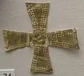 Gold cross, which indicates that the person buried was Christian