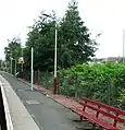 Looking down the platform, away from the station building. The posts with the yellow bands are for new CCTV equipment for use by train drivers.