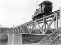 A steam locomotive runs on a railway bridge of the Dutch East Indian Railway Company on the line between Secang, Magelang and Parakan, Temanggung, Central Java