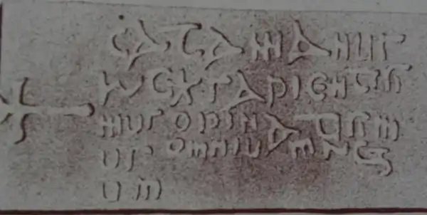 King Cadfan's gravestone in Llangadwaladr church.  The inscription reads "Catamanus rex sapientisimus opinatisimus omnium regum" (English: King Cadfan, most wise and renowned of all kings).