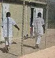 Detainees walk in an exercise yard in Camp 4, where they live in 10-man bays with nearly all-day access to the yard and other recreational privileges.
