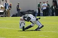 A Michigan State University drum major performing a backbend.