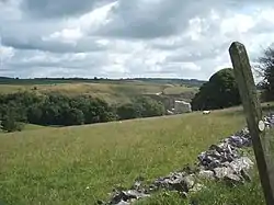 Footpath post, fields and Ivonbrook Quarry