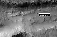 Close-up of gullies in trough, as seen by HiRISE under the HiWish program.  These are some of the smaller gullies visible on Mars.
