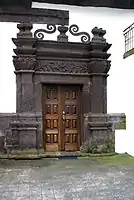 The lateral doorway in sculpted basalt