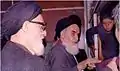 Khomeini before a speech at Alavi school