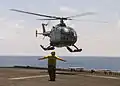 Indonesian Navy Bo. 105 lands on USS Inchon in 2001.