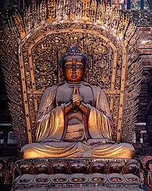 Jin Dynasty (1115–1234) statue of Vairocana in Shanhua Temple in Datong, Shanxi, China, one out of a set of statues of the Five Tathāgatas