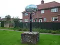 The village sign depicts the peewit bird
