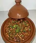 Traditional Algerian tajine mtewem served in a tajine pot in Algiers, Algeria.