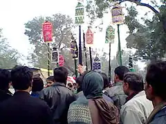 Shia Muslims carry out an Al'am procession on the day of Ashura in Barabanki, India, January 2009.