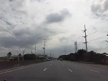 Steel poles 426–431 and original pole 127 along NLEx in Bocaue, Bulacan. Pole 426 is an anchor tower and has flag tower design while poles 427, 428, 430, and 431 are suspension towers and has triangle design. Original pole 127 and steel pole 429, however, are branch pylons and used to connect the transmission line to Meralco Duhat substation through its cut-in connection with the said substation.