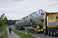 MAN ballat tractor pushing hydraulic modular trailer with bolster configuration.