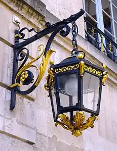 Carved and glided lantern on the street facade