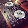 A DJ controller with jog wheels emulating decks