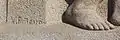 Detail of one of Xoan Piñeiro's bas-reliefs and signature