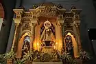 The new Left Side retablo having the Image of Nuestra Señora de la Consolacion y Correa, the Sacred Heart of Jesus and the Immaculate Heart of Mary.