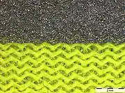 Retroreflective material in light microscope, magnification 8 x