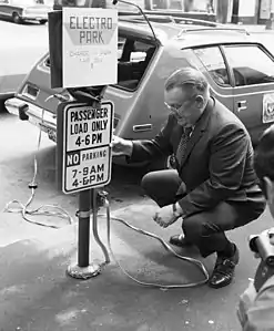 This 1973 photo of a charging station in Seattle shows an AMC Gremlin, modified to take electric power; it had a range of about 50 miles (80 km) on one charge.