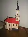 A scale model of the church made by László Kasza, displayed in the Serbian Club
