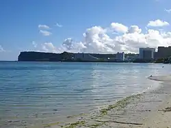 The sihouette of Two Lovers Point dominates the view north from the Tumon tourist center