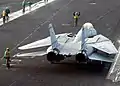 A Grumman F-14 Tomcat with its wings in the "oversweep" position
