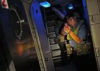 A Royal Brunei Navy sailor watch as passage way aboard USCGC Mellon (WHEC-717) during CARAT 2010.