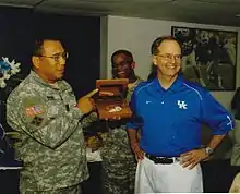 Bryant in September 2005, presenting University of Kentucky President Lee Todd Jr. with an award.