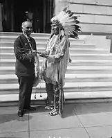 Vice President Curtis receives a peace pipe from Red Tomahawk, slayer of Sitting Bull